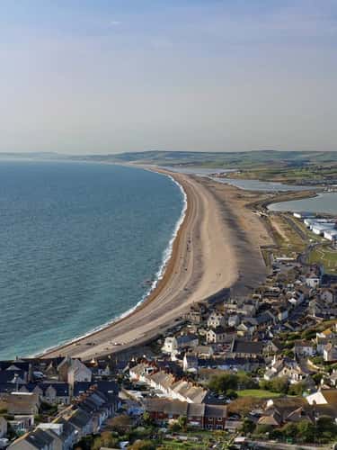 Overview of Castletown and Chesil Beach from Portland Heights, the Isle of Portland, Dorset, UK, October 2023