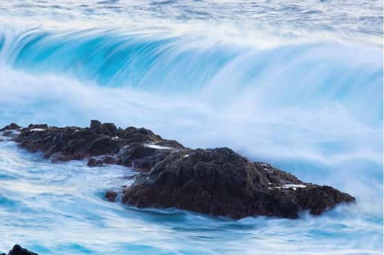 Coastal rocks feel erosive tidal power, Tenerife, Canary Islands, April