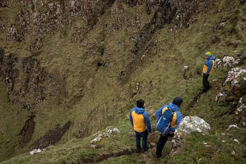 LIFE Raft team members assess cliffs, Rathlin Island, Northern Ireland, UK, March