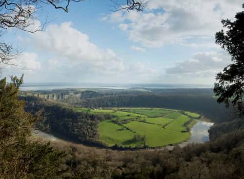 Wye Valley, iconic view from Eagle's Nest across meander of River Wye towards Wintour's Leap cliffs and the Severn Estuary, birthplace of British tourism, Lancaut, Chepstow, Monmouthshire, March 2024