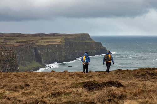 Team members of the Rathlin Island LIFE Raft project assessing the island for the upcoming ferret eradication, Northern Ireland, UK, March