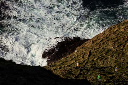 LIFE Raft team members assess cliffs, Rathlin Island, Northern Ireland, UK, March