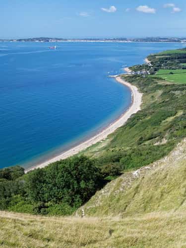 View from Burning Cliff to Ringstead Bay and the Isle of Portland, Dorset, UK, August 2023